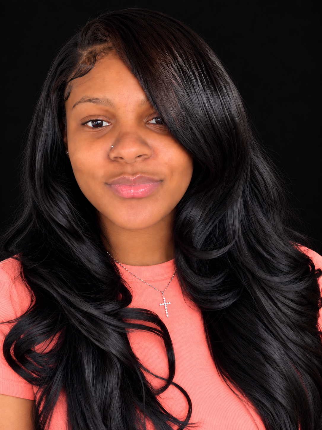 Ambrea, founder of Ambrea Luxe Bundles, wearing a pink shirt